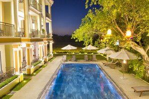 Outdoor pool, open 6:00 AM to 10:00 PM, pool umbrellas, pool loungers