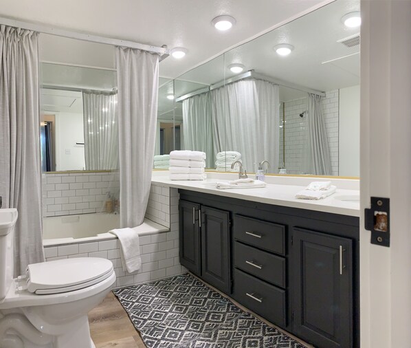 Combined shower/tub, hair dryer, towels, soap