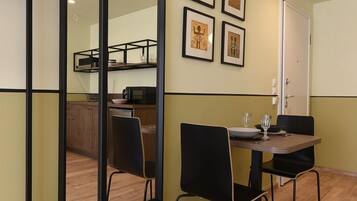 Apartment, 1 Bedroom, City View (4B) | Living area | 29-inch Smart TV with cable channels