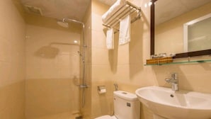 A bathroom with a shower, toilet, sink, and a towel rack. - The Samson Boutique Hotel (Da Nang)