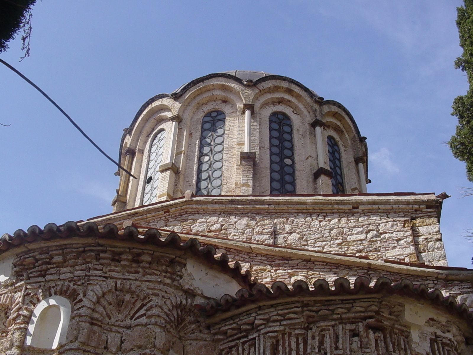 A historic building with a dome and arched windows.