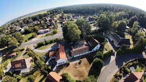 An aerial view of a residential area with houses, roads, and greenery. - Hotel Rosenhof (Bergen)