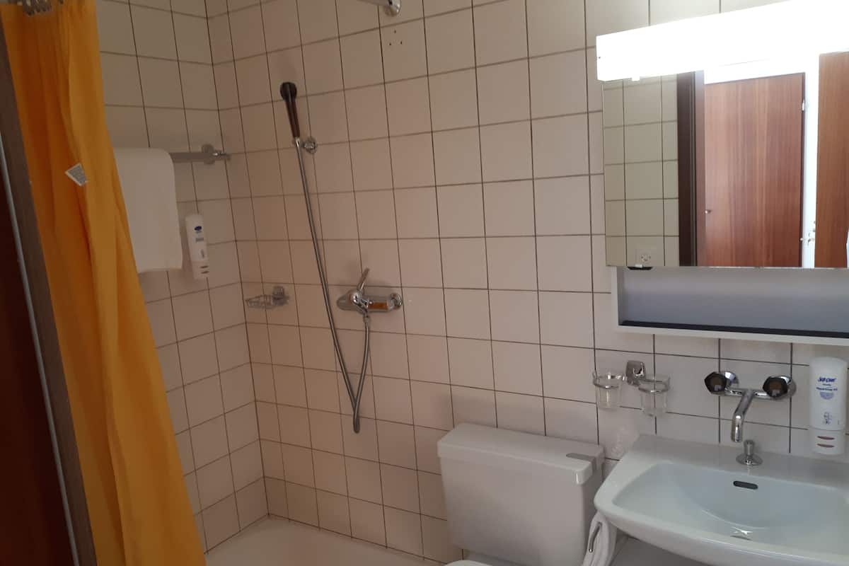 standard quadruple room, multiple beds | bathroom | hair dryer, towels