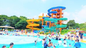 A water park with multiple water slides and a swimming pool. - Aso Kumamoto Airport Hotel Eminence (Mashiki)