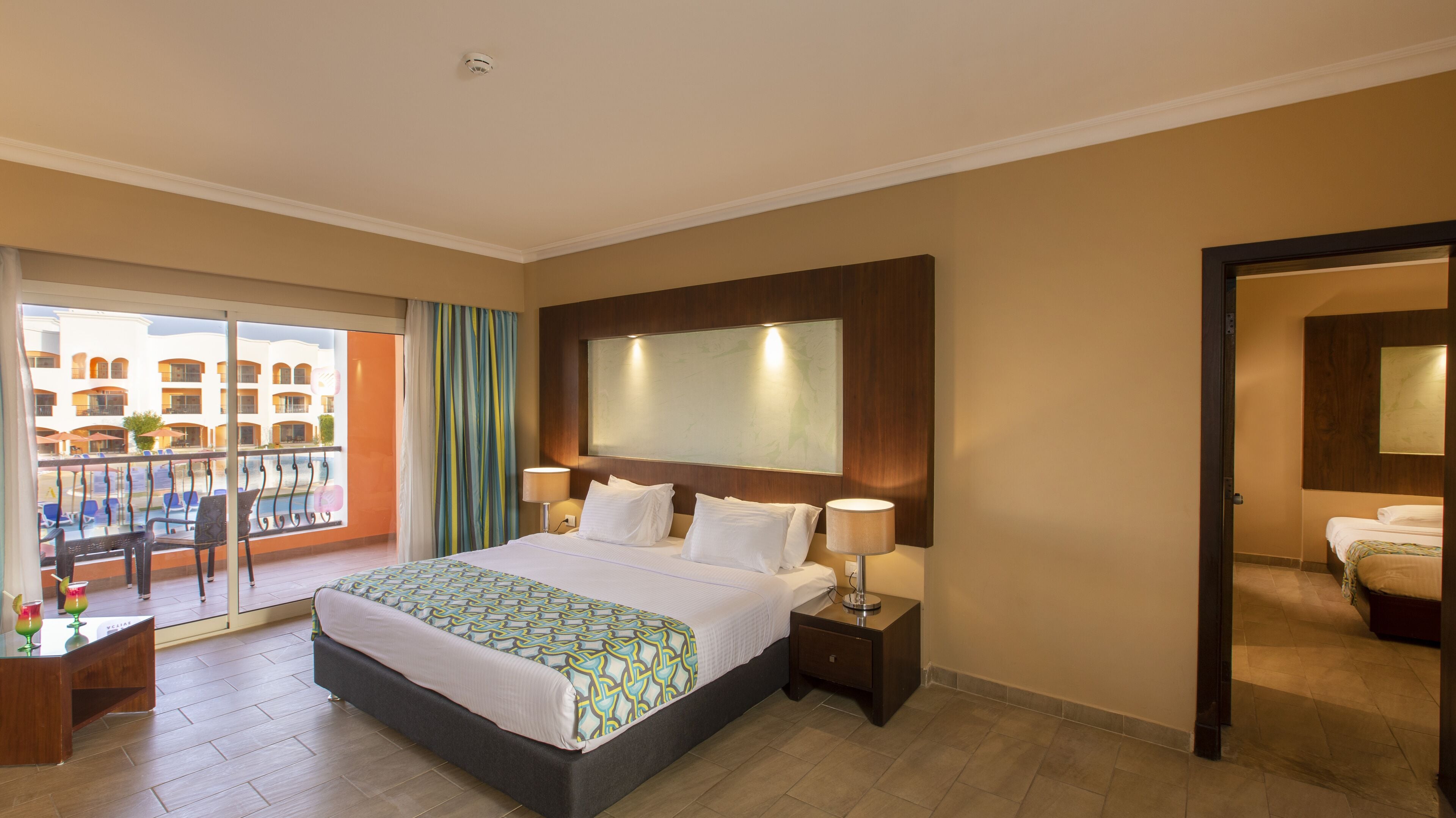 family room | 1 bedroom, minibar, in-room safe, blackout curtains