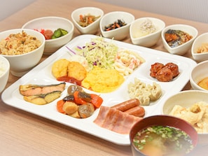 A variety of dishes on a rectangular white plate, including fish, vegetables, and meat. - Ichihara Inn Social Anesaki (Ichihara)