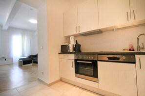 Senior Apartment, 2 Bedrooms, Ground Floor | Private kitchen | Full-sized fridge, microwave, oven, stovetop - Edelweiss city Apartments United Nations (Vienna)