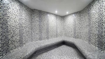 Experience a visually striking space with a unique mosaic tile design and inviting atmosphere.