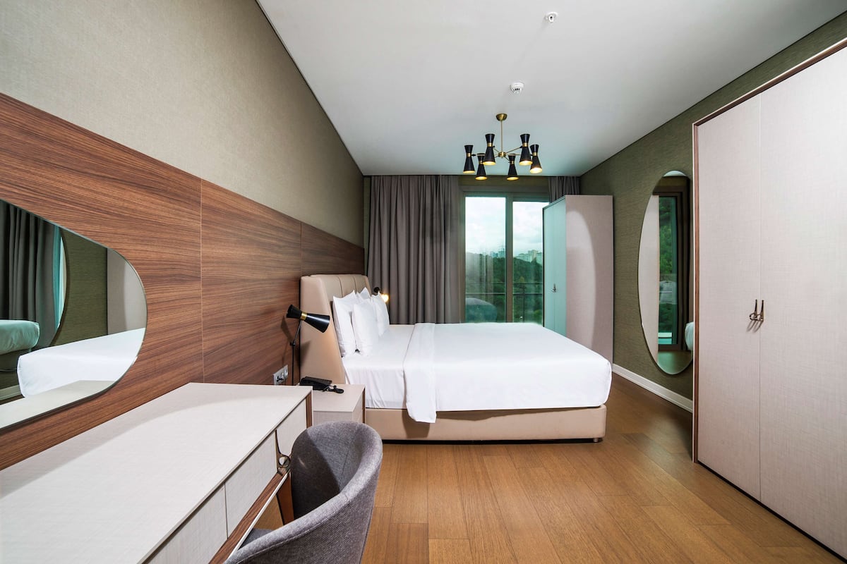 Premium bedding, down duvets, memory-foam beds, in-room safe