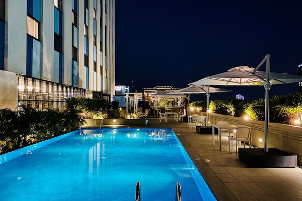 Outdoor pool, open 7:00 AM to 10:00 PM, sun loungers