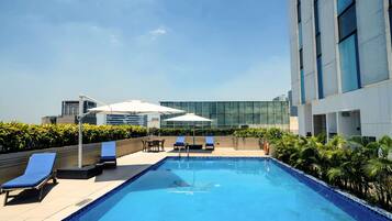 Outdoor pool, open 7:00 AM to 10:00 PM, sun loungers