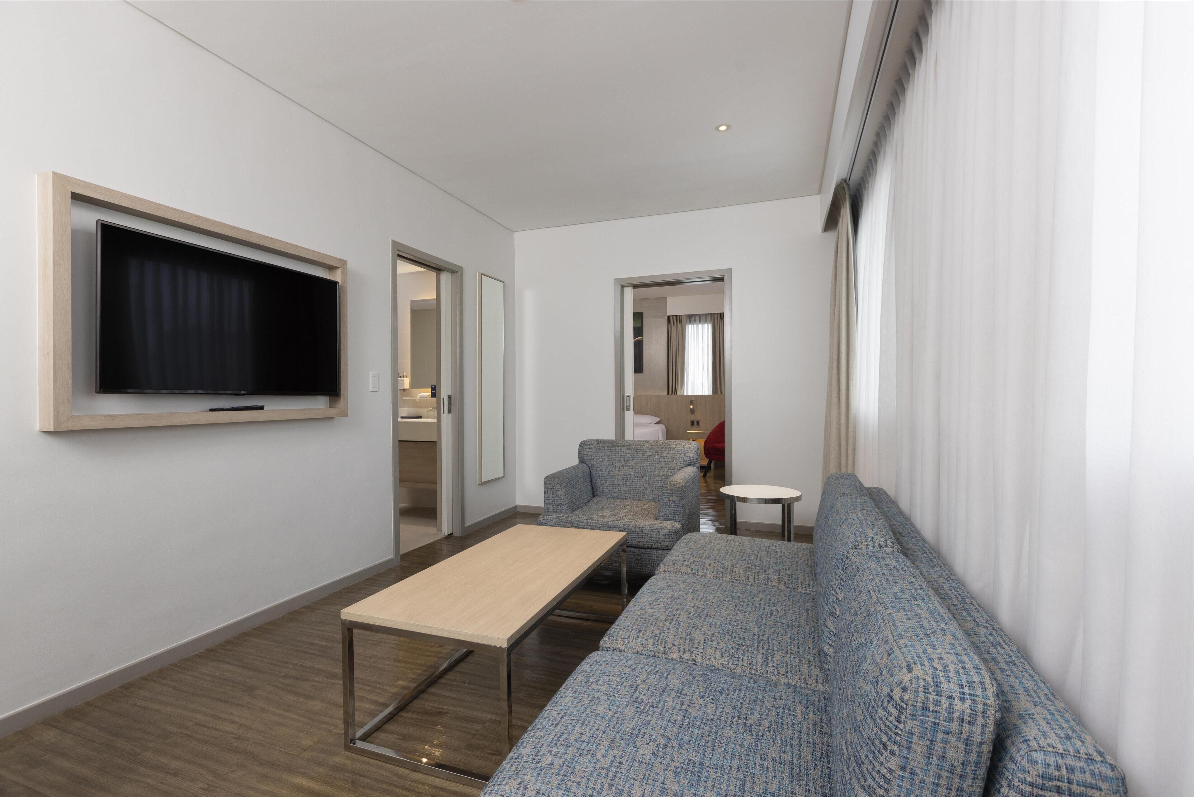 suite, 1 bedroom | 1 bedroom, down duvets, in-room safe, desk