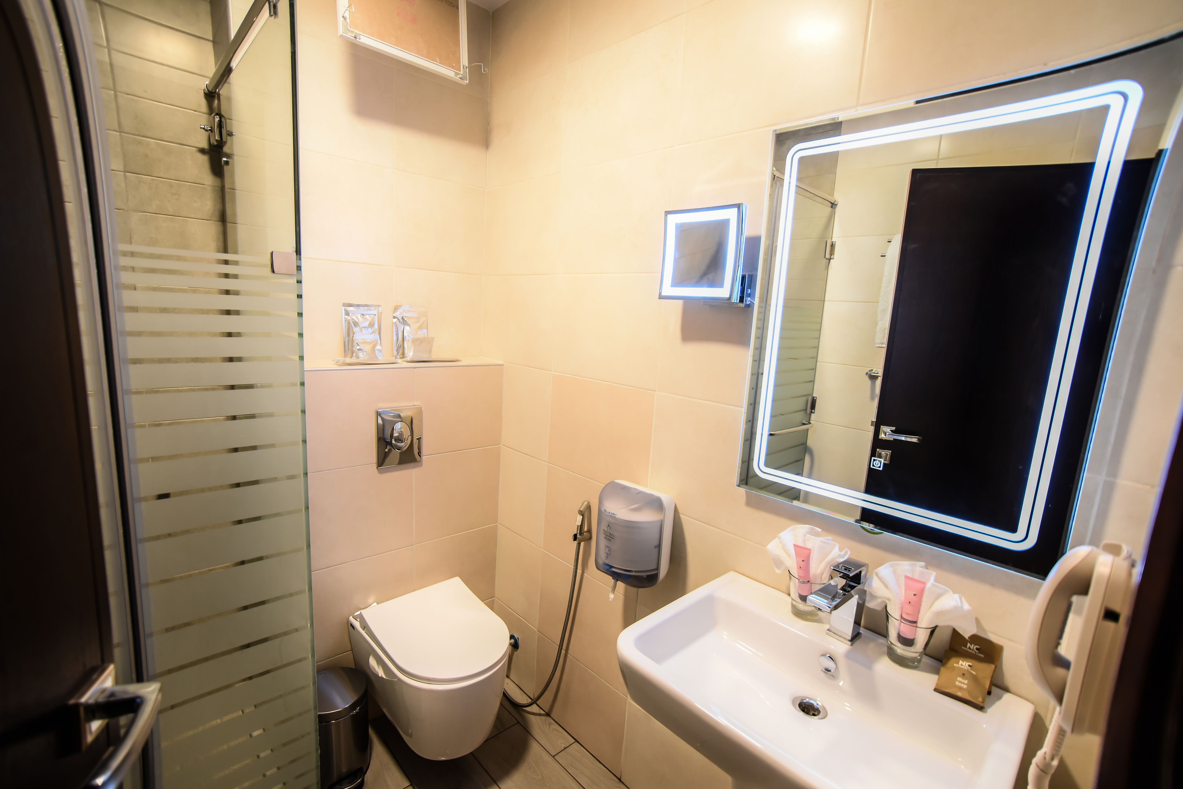 shower, hair dryer, bathrobes, slippers