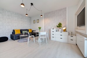 Comfort Apartment, Balcony (4 people) | Living area | Flat-screen TV