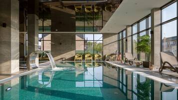 Indoor pool, seasonal outdoor pool, pool loungers, lifeguards on site