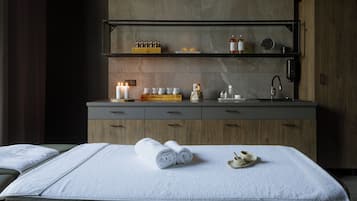 Enjoy a restful stay in this stylish hotel room featuring a comfortable bed, a convenient tea station, and a spacious cabinet with a mirror.