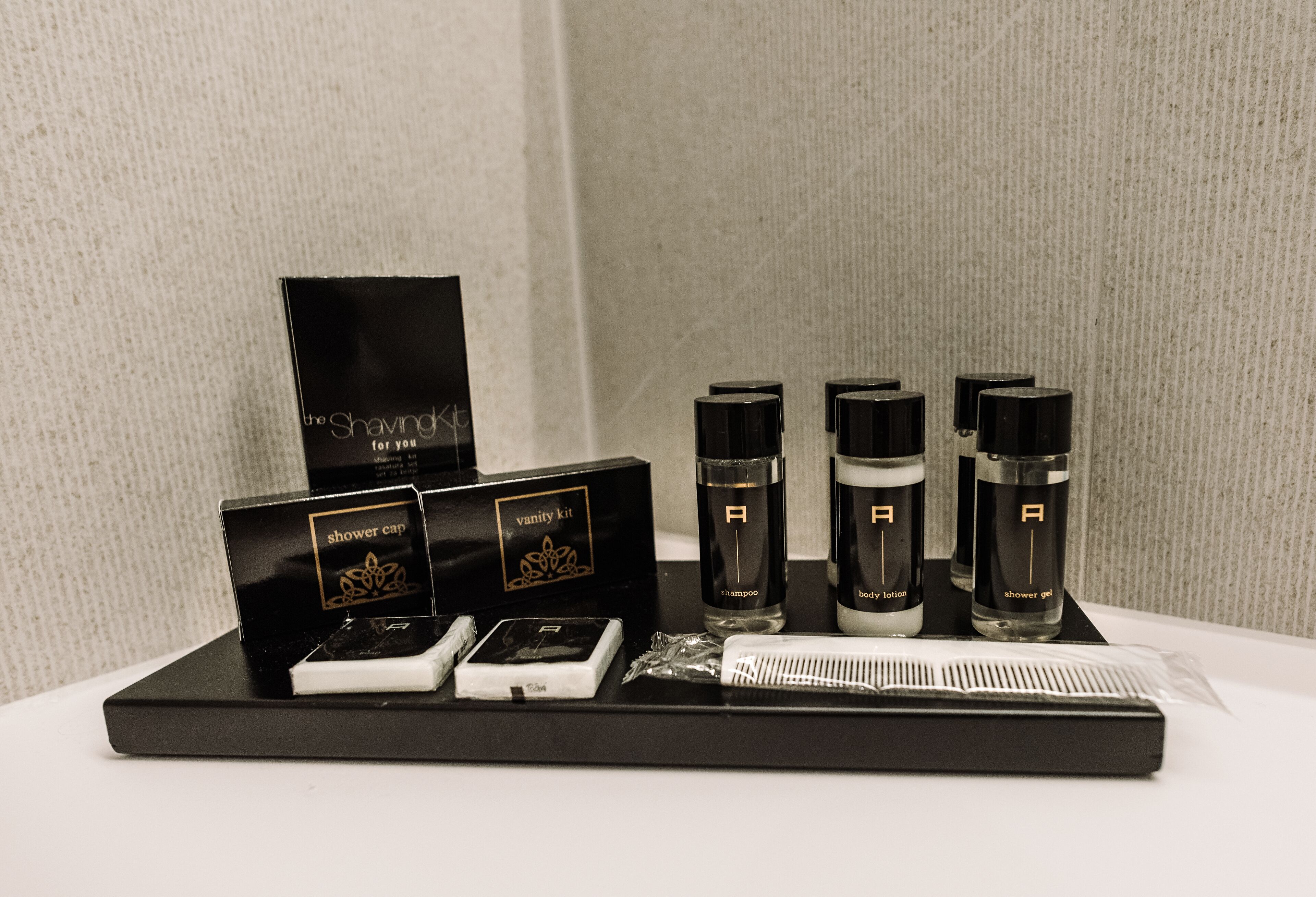 luxury studio suite, 1 king bed with sofa bed | bathroom amenities | free toiletries, hair dryer, slippers, towels