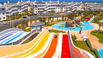 A water park with multiple slides and a pool area.