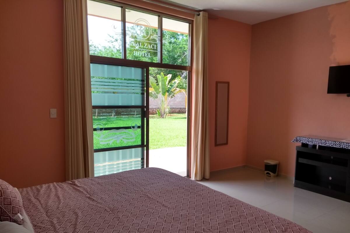 Junior Suite, Garden View | Minibar, in-room safe, laptop workspace, blackout curtains