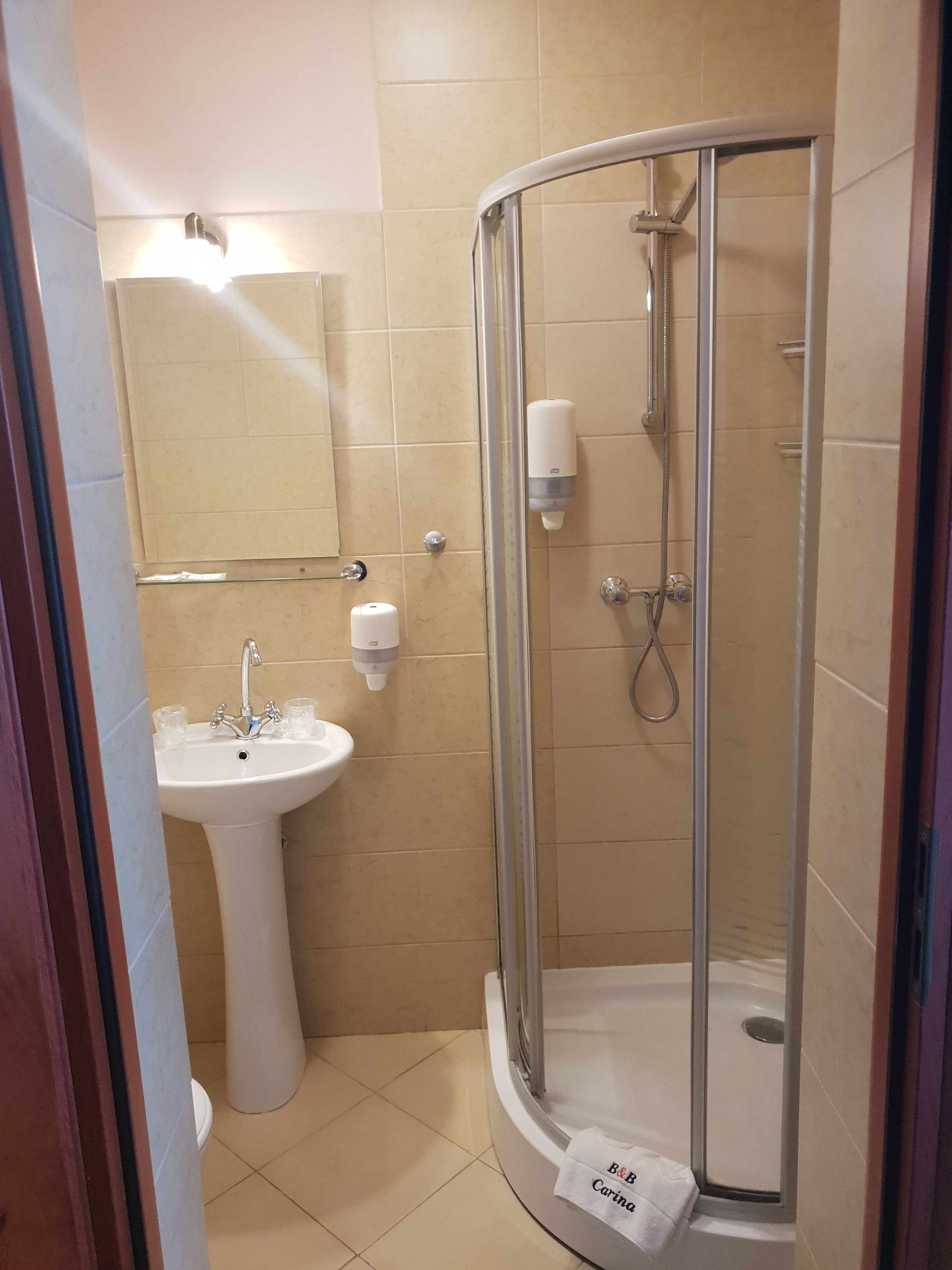 single room | bathroom | shower, hair dryer, towels, soap