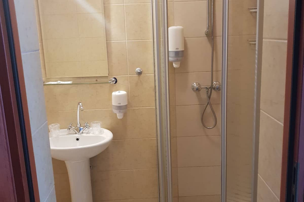 single room | bathroom | shower, hair dryer, towels, soap