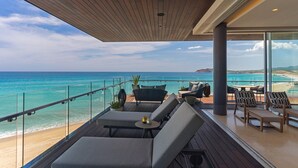 A modern outdoor lounge area with a view of the ocean and beach. - The Residences at Solaz, a Luxury Collection Resort, Los Cabos a Marriott Hotel (San José del Cabo)