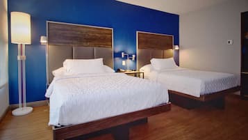 Premium bedding, desk, laptop workspace, blackout drapes
