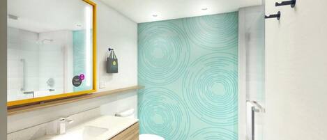 A modern bathroom with a large mirror, two sinks, a toilet, and a shower area.