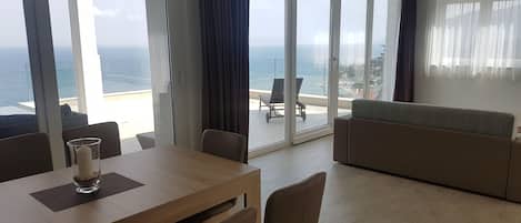 Penthouse, Sea View | Living area | Flat-screen TV