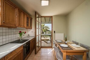 Villa | Private kitchen | Fridge, microwave, oven, stovetop