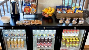 A self-service beverage station with various drinks and snacks. - Idaho Lodge and RV Park (Bonners Ferry)