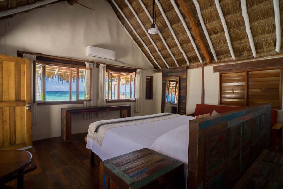 Royal Cabin, 1 Double Bed, Ocean View, Beachfront | 1 bedroom, in-room safe, free WiFi, bed sheets