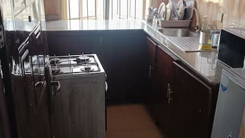 Comfort Apartment, 3 Bedrooms | Private kitchen | Full-sized fridge, microwave, oven, stovetop