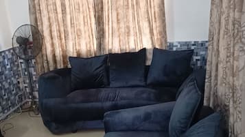 Comfort Apartment, 3 Bedrooms | Living area | 32-inch TV with satellite channels, Netflix, streaming services