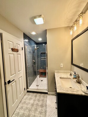 Combined shower/tub, hair dryer, towels, soap