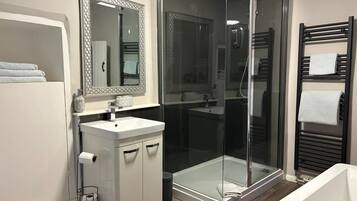 Bathtub, hair dryer, towels, soap
