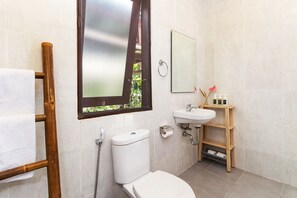 Bathtub, hair dryer, towels, soap