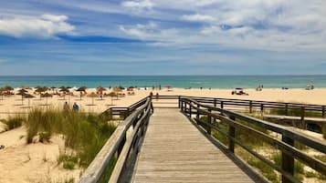 On the beach, sun loungers, beach towels