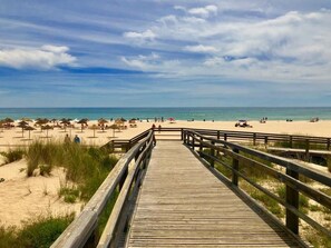 On the beach, sun-loungers, beach towels