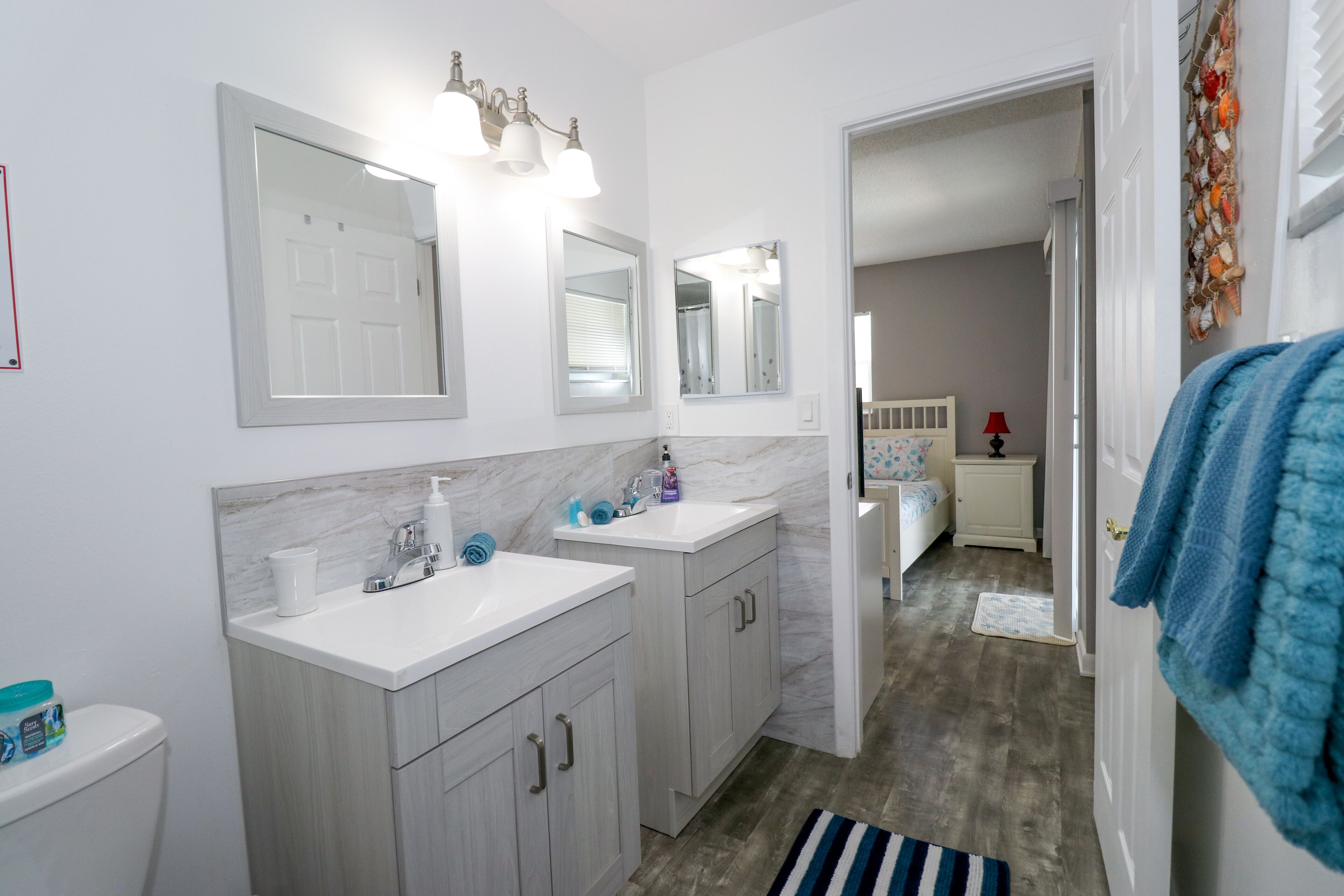 Bathtub, hair dryer, towels, toilet paper