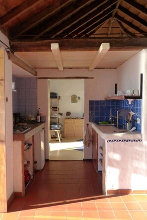 Fridge, coffee/tea maker, cookware/dishes/utensils, spices
