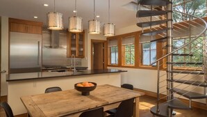 A modern kitchen with a central island, stainless steel appliances, and a spiral staircase. - AUGUST SPECIAL! Luxury home-Heart of Telluride 3B+loft; deck/VIEWS/gas fireplace (Telluride)