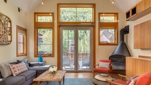 A spacious living room with a fireplace, large windows, and a cozy seating area. - AUGUST SPECIAL! Luxury home-Heart of Telluride 3B+loft; deck/VIEWS/gas fireplace (Telluride)