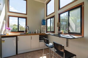 Fridge, microwave, stovetop, toaster - Sithuri Tiny House by Tiny Away (Windeyer)