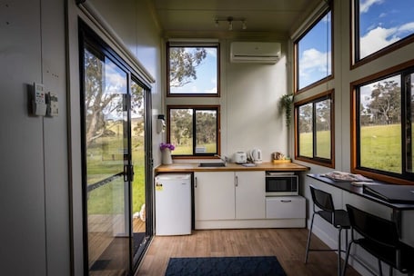 Fridge, microwave, stovetop, toaster. Sithuri Tiny House by Tiny Away