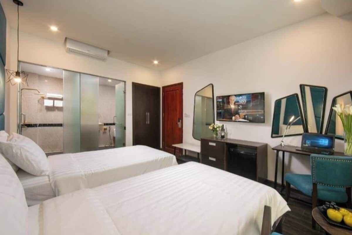 Habitación Deluxe con 2 camas individuales | Minibar, caja de seguridad en la habitación y escritorio