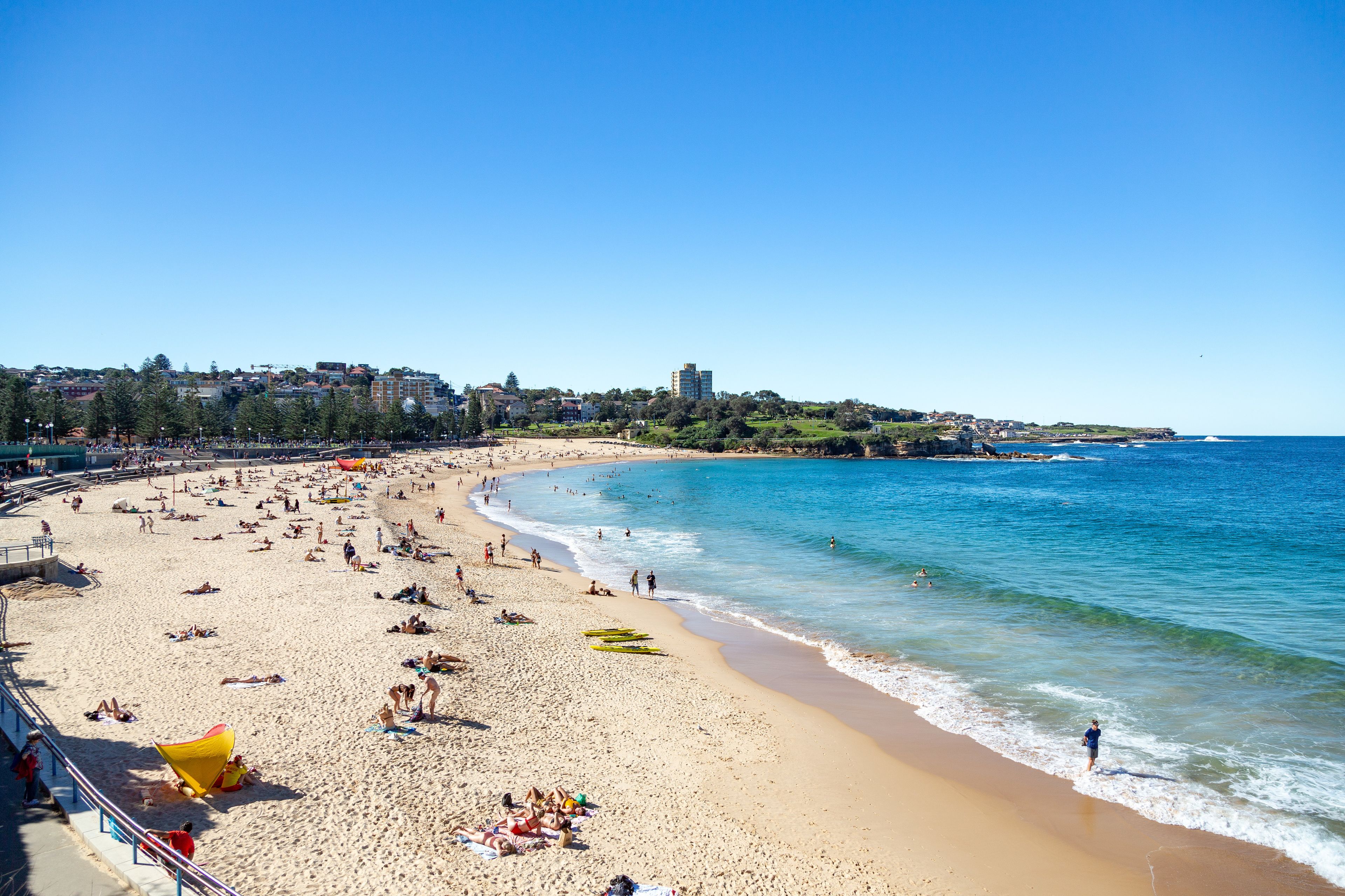 Beach nearby, white sand, beach towels