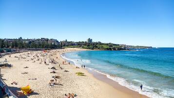 Beach nearby, white sand, beach towels
