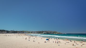 Beach nearby, white sand, beach towels