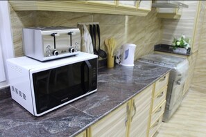 Villa, 4 Bedrooms | Private kitchen | Fridge, microwave, oven, stovetop